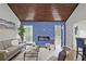 Inviting living room featuring an electric fireplace with blue paneling and stylish contemporary furnishings at 783 Lost Creek Cir, Stone Mountain, GA 30088