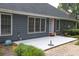 Rear exterior of home with a patio area and landscaped garden at 1520 Great Oaks Dr, Lawrenceville, GA 30045