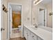 Cozy bathroom featuring a white vanity and a shower with a patterned curtain at 1520 Great Oaks Dr, Lawrenceville, GA 30045