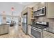 Well-equipped kitchen with stainless appliances and granite countertops adjoining breakfast nook at 1520 Great Oaks Dr, Lawrenceville, GA 30045