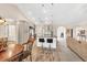 Open floor plan showcasing the kitchen with stainless appliances, marble counters and breakfast bar at 1520 Great Oaks Dr, Lawrenceville, GA 30045