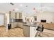 Open kitchen featuring granite counters, stainless appliances, bar stool seating and wood-look floors at 1520 Great Oaks Dr, Lawrenceville, GA 30045