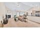 Open-concept living room with fireplace seamlessly connects to dining and kitchen at 1520 Great Oaks Dr, Lawrenceville, GA 30045