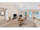 Bright living room featuring a fireplace, large windows, and comfortable seating at 1520 Great Oaks Dr, Lawrenceville, GA 30045