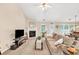 Inviting living area featuring a fireplace and a view of the dining area at 1520 Great Oaks Dr, Lawrenceville, GA 30045