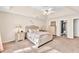 This main bedroom features a plush bed, coordinated bedside tables, and a ceiling fan for added comfort at 1520 Great Oaks Dr, Lawrenceville, GA 30045