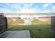A grassy backyard with a rock drainage feature behind a fence at 1560 Iris Walk, Jonesboro, GA 30238