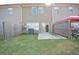 Enclosed backyard with small patio and lawn at 1560 Iris Walk, Jonesboro, GA 30238