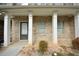 Inviting front porch with brick pillars, offering a cozy entrance to the home at 1560 Iris Walk, Jonesboro, GA 30238