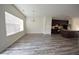 Open-concept living space combining dining and kitchen areas with wood-like floors and natural light at 1560 Iris Walk, Jonesboro, GA 30238