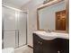 Bathroom with a shower over the bath and modern vanity at 1791 Lake George Dr, Lithia Springs, GA 30122