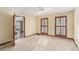 The bedroom has neutral carpet, a ceiling fan, and wood trim windows that bring in lots of natural light at 1791 Lake George Dr, Lithia Springs, GA 30122