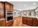 Open-concept kitchen features stainless steel appliances, granite countertops, and hardwood floors at 1791 Lake George Dr, Lithia Springs, GA 30122