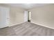 Carpeted bedroom with window, neutral walls, and closet space at 2240 Spalding Dr, Marietta, GA 30062
