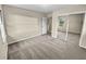 Carpeted bedroom features closet, windows and neutral walls, providing ample light at 2240 Spalding Dr, Marietta, GA 30062