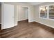 A bright bedroom features hardwood flooring and natural light at 2240 Spalding Dr, Marietta, GA 30062
