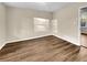 Bright bedroom with hardwood flooring, neutral paint, and natural light at 2240 Spalding Dr, Marietta, GA 30062