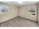 Bedroom with carpet, two windows and neutral walls, providing ample light at 2240 Spalding Dr, Marietta, GA 30062