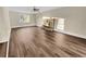 Open living room with wood floors and a stone fireplace at 2240 Spalding Dr, Marietta, GA 30062
