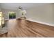 Spacious living room featuring wood flooring, a stone fireplace, and a sliding glass door at 2240 Spalding Dr, Marietta, GA 30062