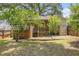 A home featuring a back yard with wooden fence and a wooden porch at 3146 Alston Dr, Decatur, GA 30032