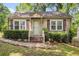 Charming single-story home featuring a cozy front porch and well-maintained landscaping at 3146 Alston Dr, Decatur, GA 30032