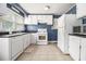 Bright eat-in kitchen featuring white cabinets, modern appliances, and tile flooring at 3146 Alston Dr, Decatur, GA 30032