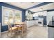 Bright eat-in kitchen with white cabinets, stainless steel appliances, and ample counter space at 3146 Alston Dr, Decatur, GA 30032