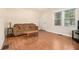 Cozy living room with hardwood floors, a comfortable sofa, and natural light at 3146 Alston Dr, Decatur, GA 30032