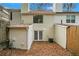 Backyard featuring a patio covered in leaves, and an exterior view of home at 7004 Pat Mell Se Pl, Smyrna, GA 30080
