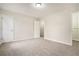 Spacious bedroom featuring neutral carpet, fresh paint, and ample closet space at 7004 Pat Mell Se Pl, Smyrna, GA 30080