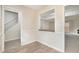 Dining area featuring wood floors and view to staircase and living area at 7004 Pat Mell Se Pl, Smyrna, GA 30080