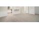 Open-concept living room flows to kitchen, neutral tones, and lots of natural light at 7004 Pat Mell Se Pl, Smyrna, GA 30080