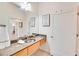 Well-lit bathroom with granite countertop, and a large mirror at 1430 Dresden Ne Dr # 225, Atlanta, GA 30319