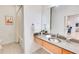 Bright bathroom with granite countertop, stainless steel sink, and subway tile shower at 1430 Dresden Ne Dr # 225, Atlanta, GA 30319
