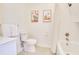 Clean bathroom features a white toilet, bathtub with shower, and art at 1430 Dresden Ne Dr # 225, Atlanta, GA 30319