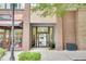 Building entrance with glass door, sidewalk, and retail next door at 1430 Dresden Ne Dr # 225, Atlanta, GA 30319