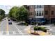 Street view of Village Place with restaurants and shops, featuring outdoor seating and vibrant street life at 1430 Dresden Ne Dr # 225, Atlanta, GA 30319