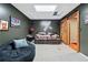 Cozy basement retreat has comfortable seating, entertainment area and plenty of room to relax at 220 Galesburg Dr, Lawrenceville, GA 30044