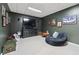 Basement features a TV, comfy furniture, and decor for entertaining, perfect for relaxation at 220 Galesburg Dr, Lawrenceville, GA 30044