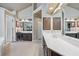 Bathroom showcasing double vanity, mirrors and high ceilings at 220 Galesburg Dr, Lawrenceville, GA 30044