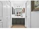 Bright bathroom with a modern vanity, framed mirror and ample cabinet space at 220 Galesburg Dr, Lawrenceville, GA 30044