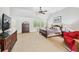 Large bedroom with vaulted ceilings, carpet, and ample room for a seating area at 220 Galesburg Dr, Lawrenceville, GA 30044