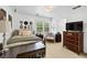 Cozy bedroom with stylish decor, natural light, and comfortable furnishings at 220 Galesburg Dr, Lawrenceville, GA 30044