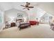 Spacious bedroom with vaulted ceilings, carpet, and room for a seating area at 220 Galesburg Dr, Lawrenceville, GA 30044