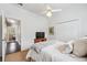 Bedroom with large closet, ceiling fan and adjacent bathroom with great natural light at 220 Galesburg Dr, Lawrenceville, GA 30044