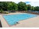Community pool with a sun cover providing a communal space for relaxation and recreation on a bright day at 220 Galesburg Dr, Lawrenceville, GA 30044