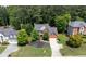 Brick home with well-maintained landscaping, two-car garage and driveway, set in a lush, green neighborhood at 220 Galesburg Dr, Lawrenceville, GA 30044