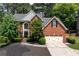 Traditional two-story brick home with well-maintained landscaping and a classic architectural design at 220 Galesburg Dr, Lawrenceville, GA 30044