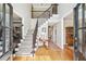 Elegant foyer featuring hardwood floors, a staircase, and views into the living spaces at 220 Galesburg Dr, Lawrenceville, GA 30044